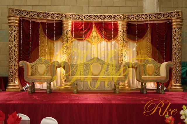 golden jali round pillar wedding mandap and stage